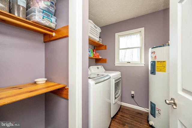 laundry room with dark hardwood / wood-style floors, independent washer and dryer, a textured ceiling, and water heater