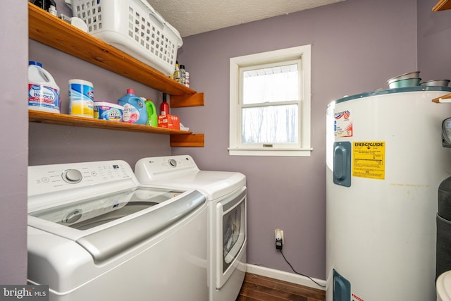 laundry room featuring a textured ceiling, washer and clothes dryer, dark wood-type flooring, and water heater