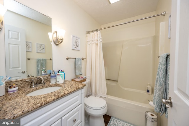 full bathroom with shower / bathtub combination with curtain, vanity, a textured ceiling, and toilet