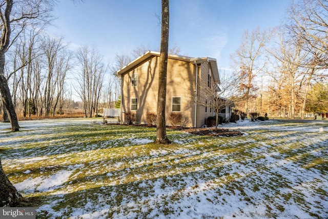 view of snow covered house