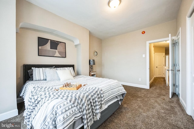 bedroom with dark carpet