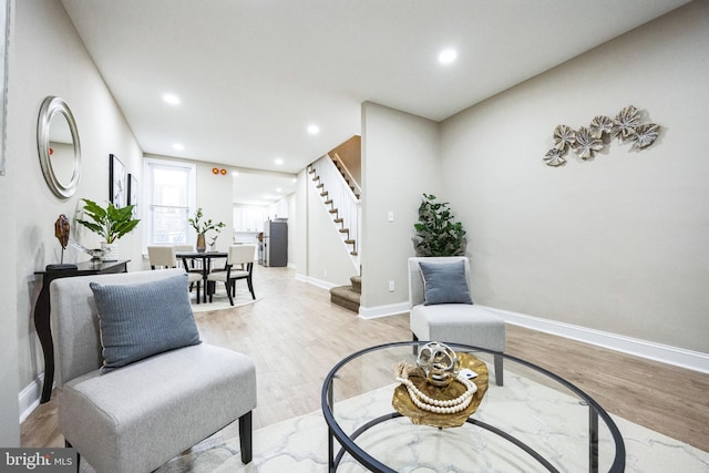 living area with light hardwood / wood-style floors