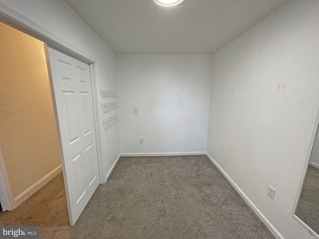 spare room featuring carpet floors