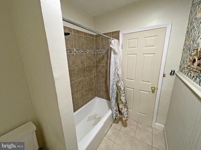 bathroom with tile patterned flooring and shower / tub combo