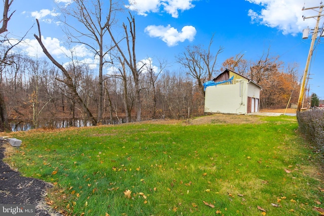 view of yard featuring a garage