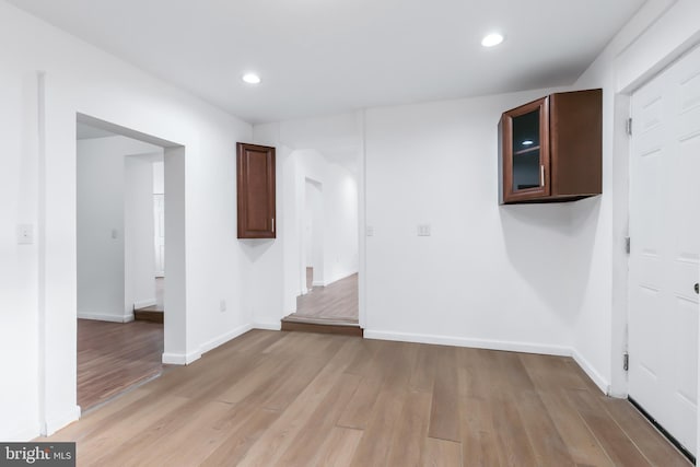 spare room featuring light hardwood / wood-style floors