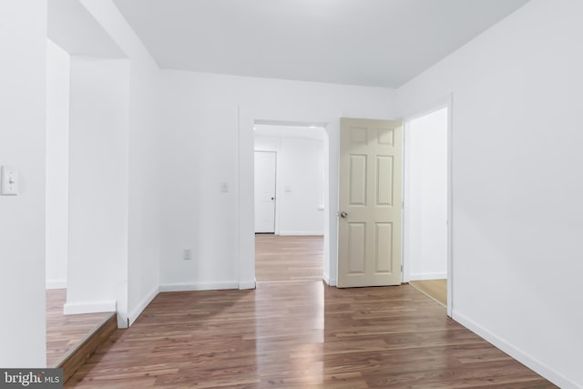 spare room with wood-type flooring