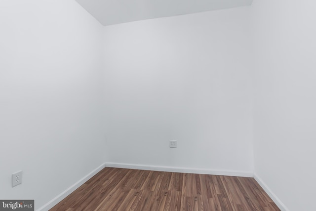 unfurnished room featuring dark hardwood / wood-style floors