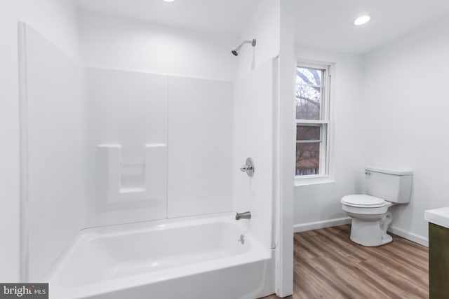 full bathroom featuring vanity, toilet, shower / bathing tub combination, and hardwood / wood-style flooring