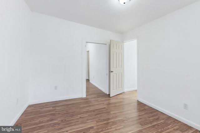 empty room featuring wood-type flooring