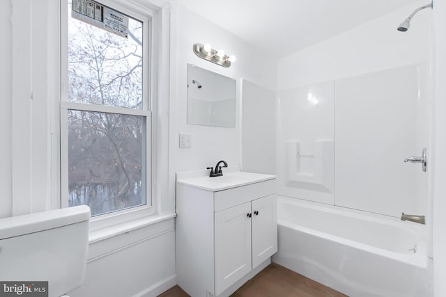 full bathroom featuring vanity, shower / bath combination, and toilet