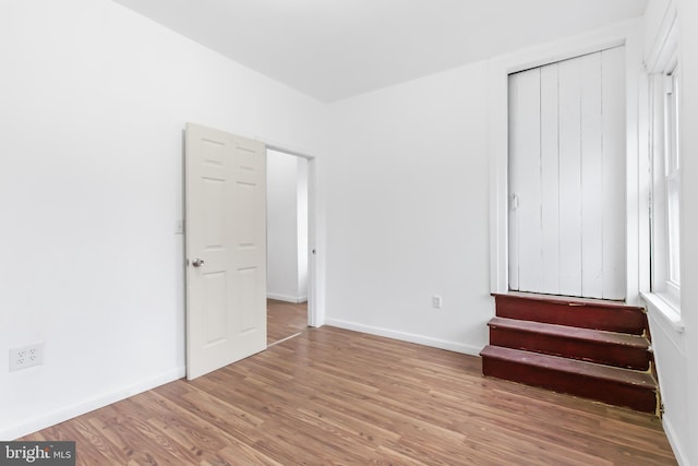 unfurnished bedroom featuring hardwood / wood-style floors