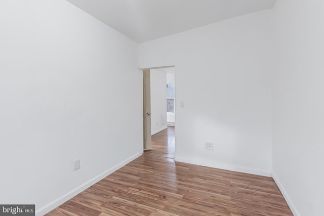 spare room featuring hardwood / wood-style flooring