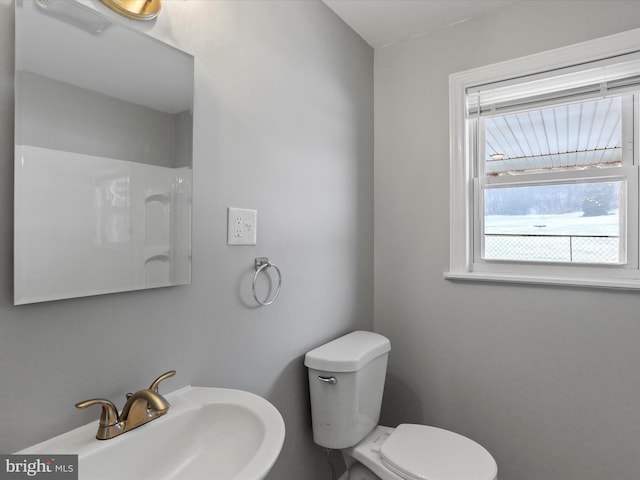 bathroom with toilet and sink