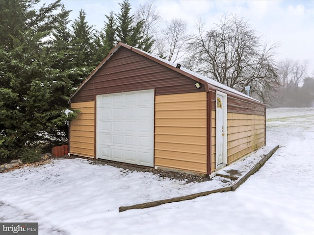 view of snow covered garage