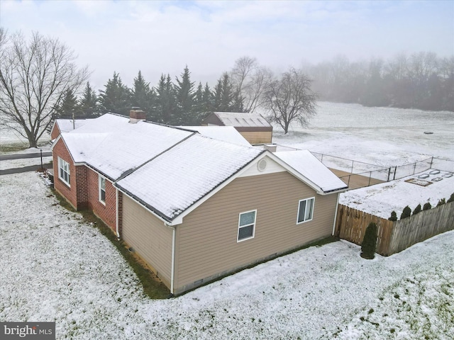 view of snow covered property