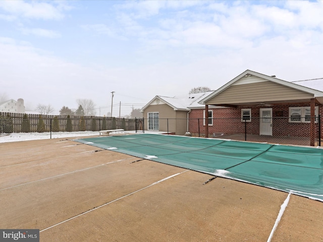 view of swimming pool with a patio area and ceiling fan