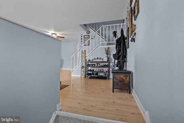 hall with hardwood / wood-style flooring