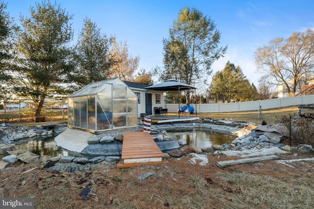 14 Limestone Ct, Lititz, PA 17543 - back of house featuring a greenhouse and an outbuilding