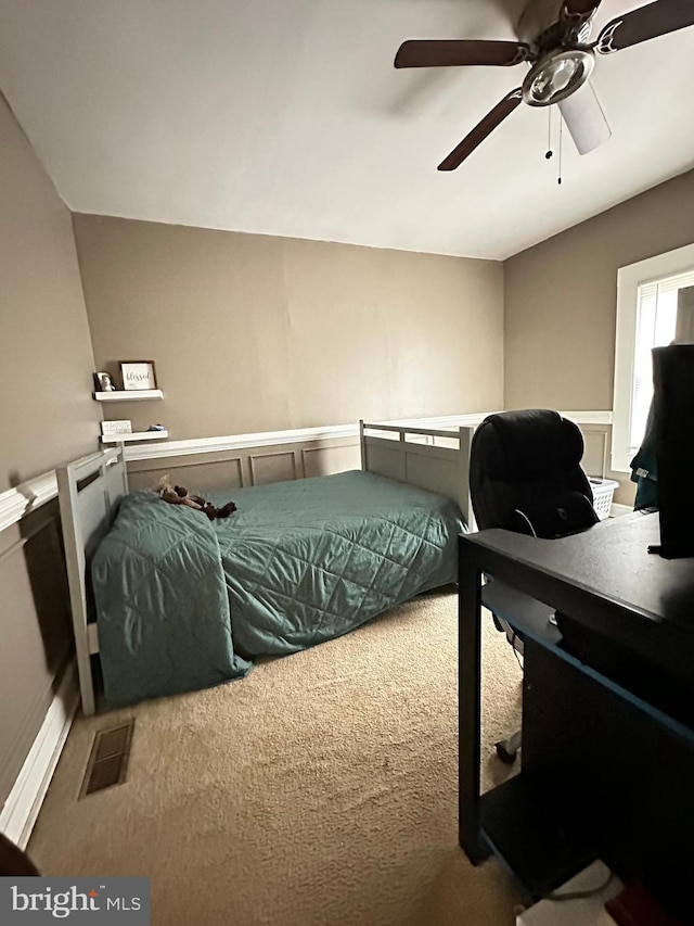 carpeted bedroom featuring ceiling fan