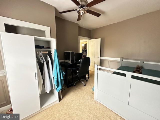 carpeted bedroom with a closet and ceiling fan