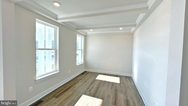 unfurnished room featuring dark wood-type flooring, a wealth of natural light, and crown molding