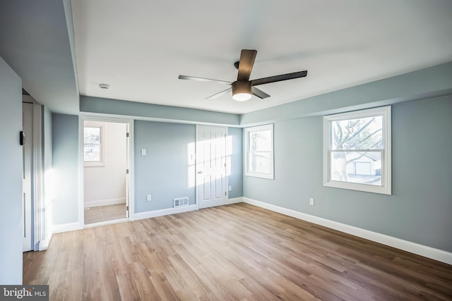 unfurnished bedroom with light hardwood / wood-style flooring and ceiling fan