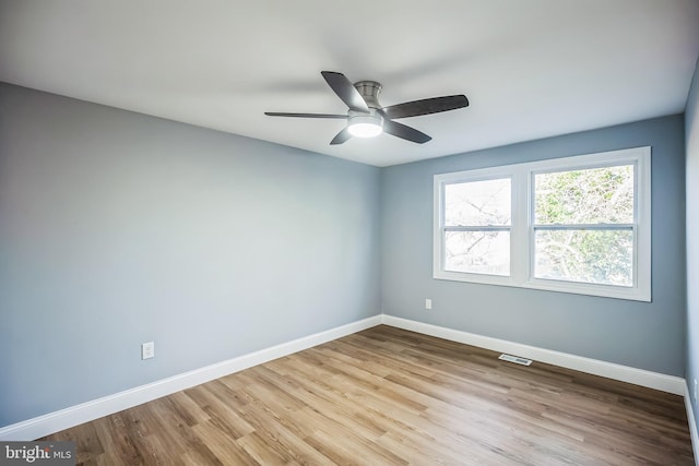 unfurnished room featuring ceiling fan and light wood-type flooring