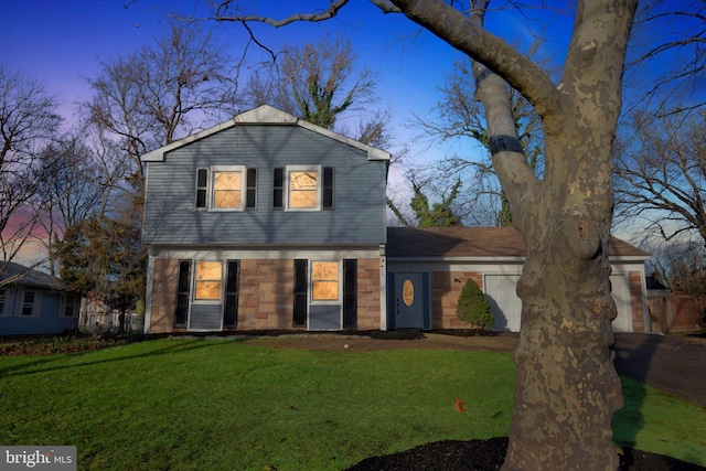 view of property featuring a lawn