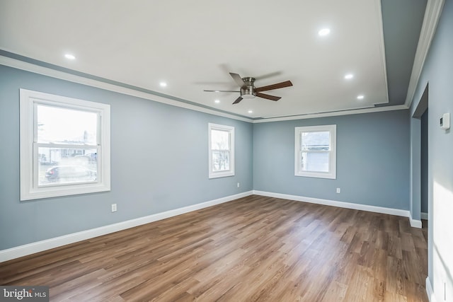 empty room with light wood-type flooring, ceiling fan, and crown molding