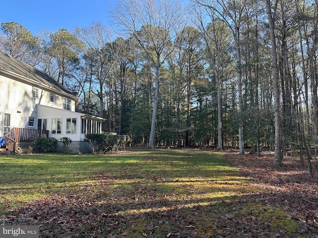 view of yard featuring a deck