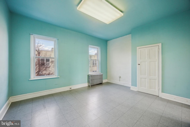 unfurnished room with radiator