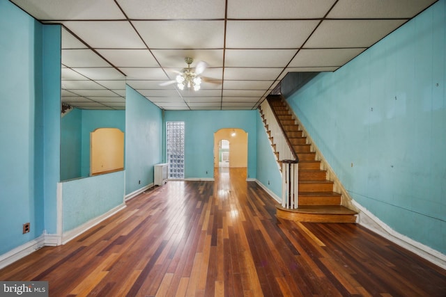 empty room with ceiling fan and wood-type flooring