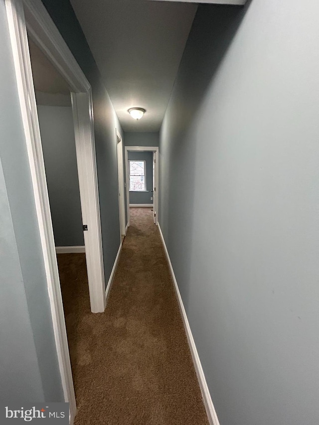 corridor with dark carpet