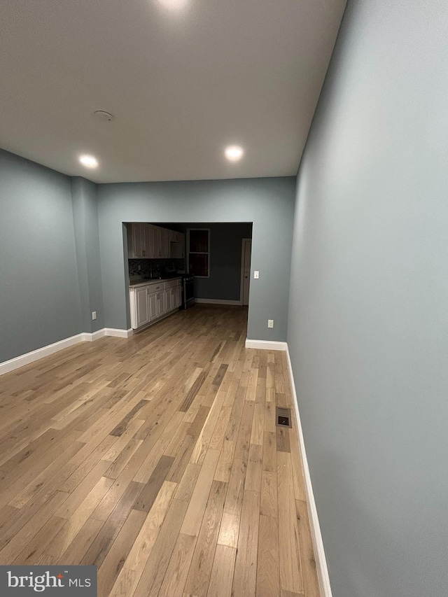 unfurnished living room with light wood-type flooring