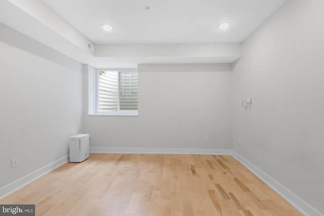 unfurnished room with light hardwood / wood-style floors