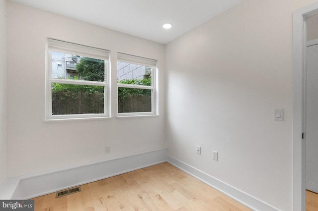 spare room with light hardwood / wood-style floors