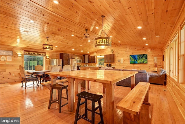 kitchen featuring wooden ceiling, light hardwood / wood-style flooring, stainless steel appliances, and lofted ceiling