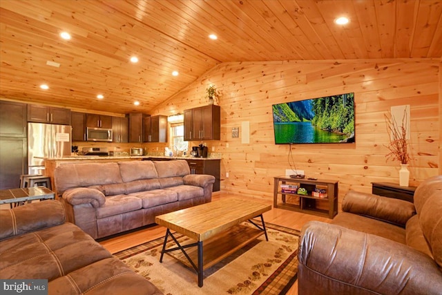 living room with wood walls, wood ceiling, lofted ceiling, and light hardwood / wood-style floors