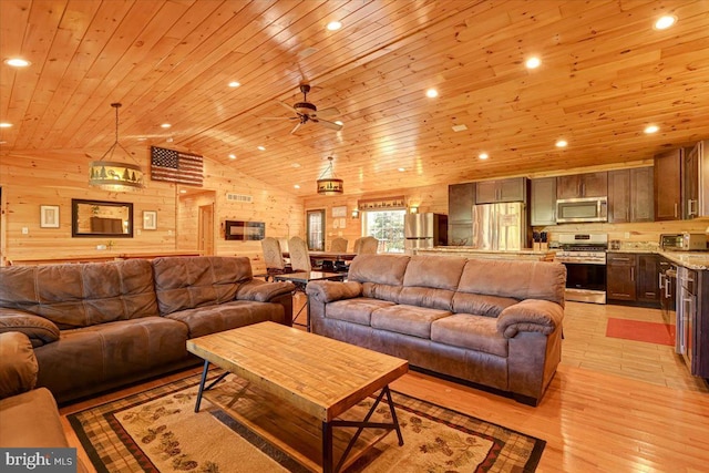 living room featuring wood walls, wooden ceiling, vaulted ceiling, ceiling fan, and light hardwood / wood-style floors