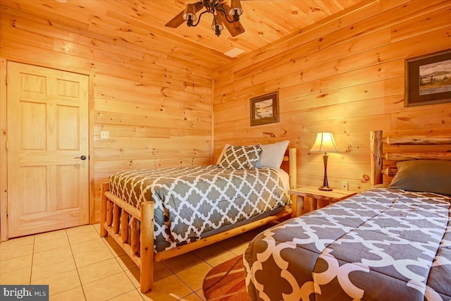 bedroom with wood walls, wooden ceiling, and light tile patterned floors