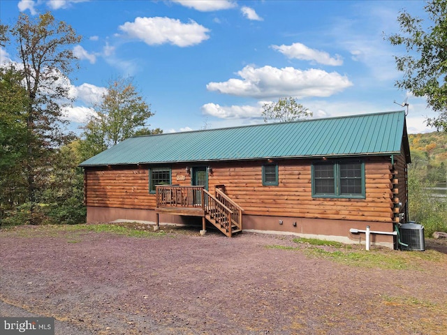 log cabin with central air condition unit