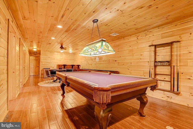 game room featuring wooden walls, pool table, wooden ceiling, and light wood-type flooring