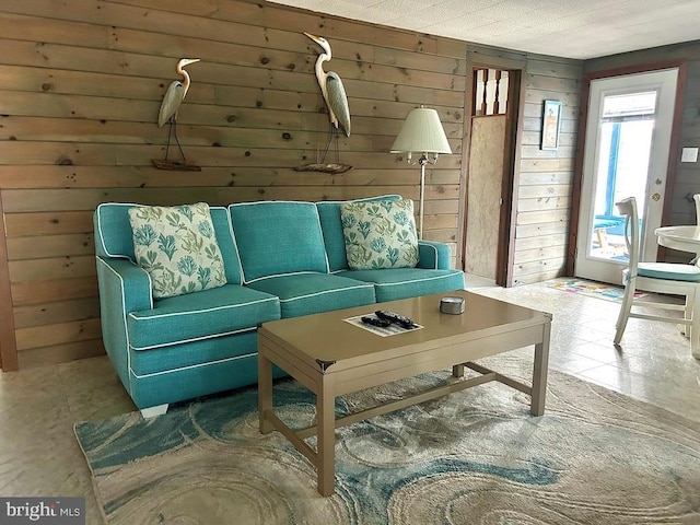 living room with wood walls