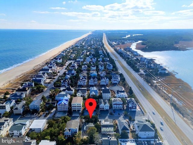 bird's eye view with a view of the beach and a water view