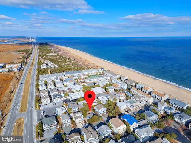 bird's eye view with a view of the beach and a water view