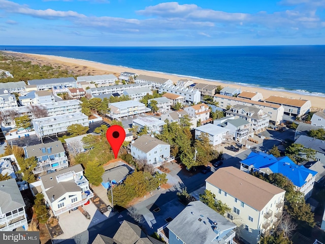 bird's eye view featuring a water view and a view of the beach