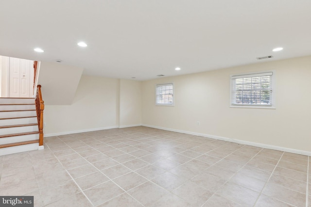 basement with light tile patterned flooring