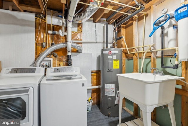 laundry area with independent washer and dryer, sink, and water heater