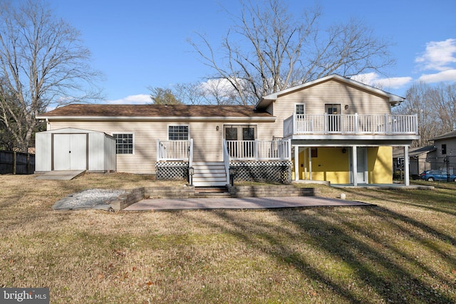 view of front of property with a shed, a deck, and a front yard